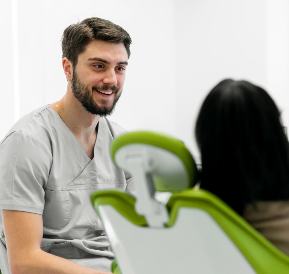 Young orthodontist started his career at Village Orthodontics and he is smiling