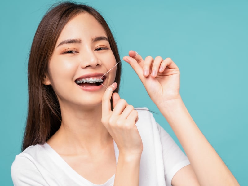 Flossing, Village Orthodontics