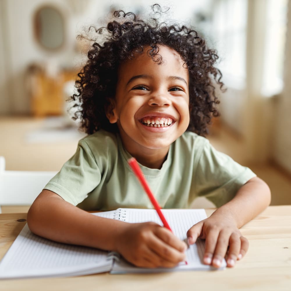 happy kid smiling in school after getting Palatal expansion treatment