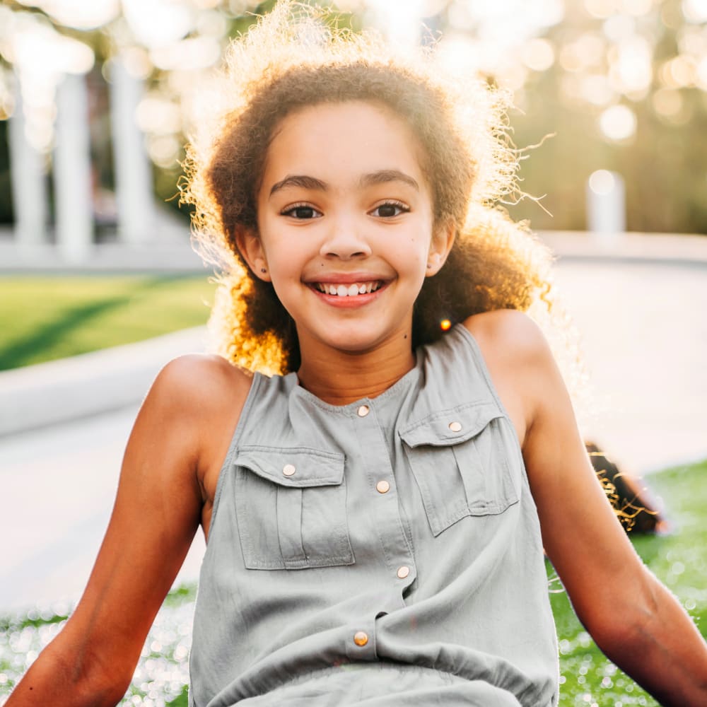 teen girl smiling after Invisalign for Teens treatment